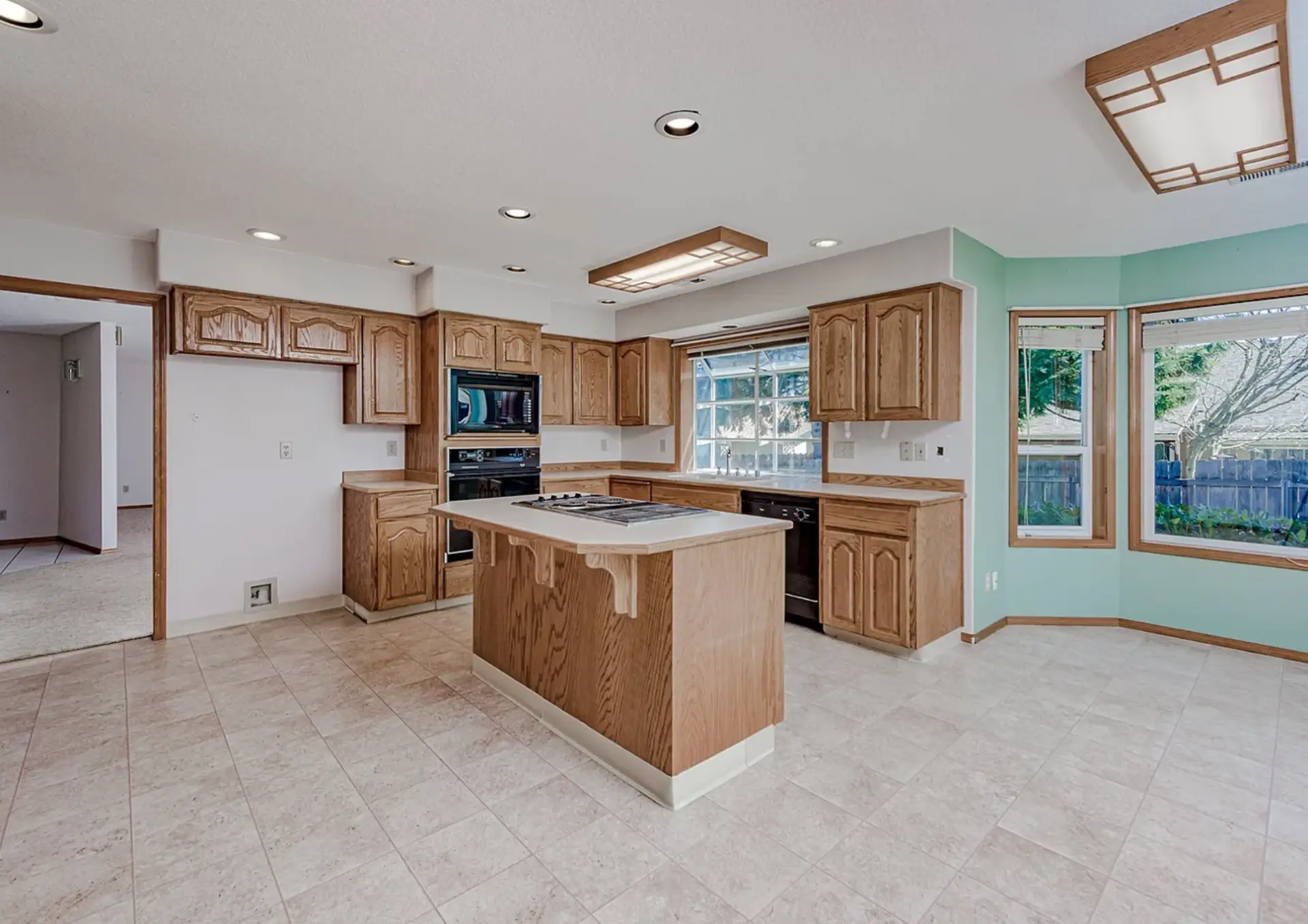 Dated oak kitchen cabinets before refinishing in Vancouver, WA